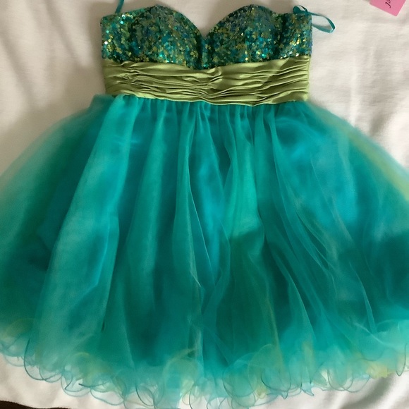 Blue sequined dress with green silk fabric across waist, puffy with silk under. - Picture 3 of 3